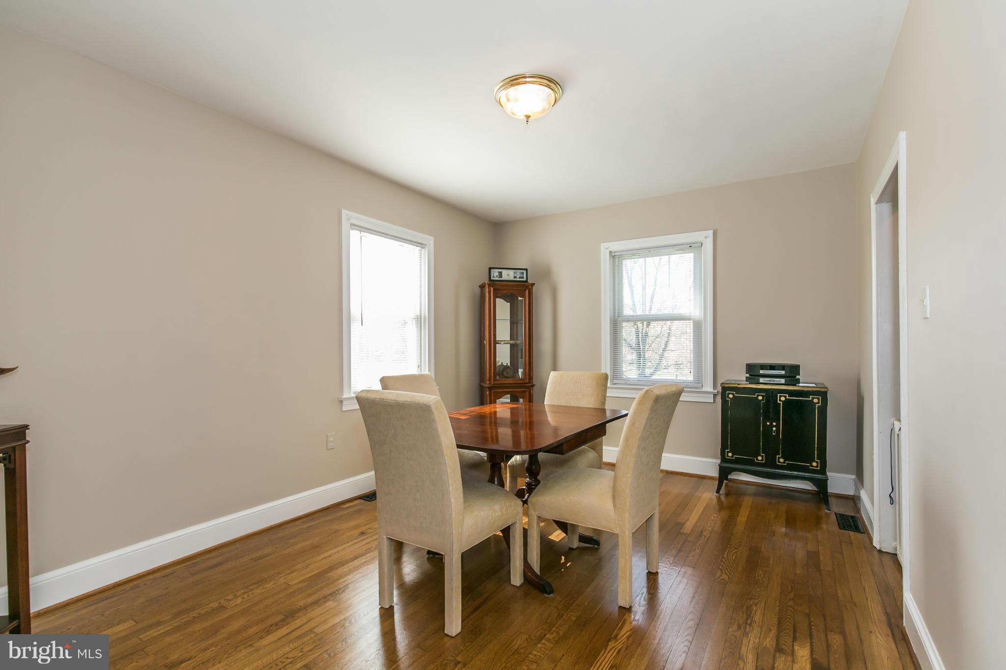 20935 Potomac View Road Sterling, VA 20165 - Photo 8 of 30 a view of a dining room with furniture window and wooden floor