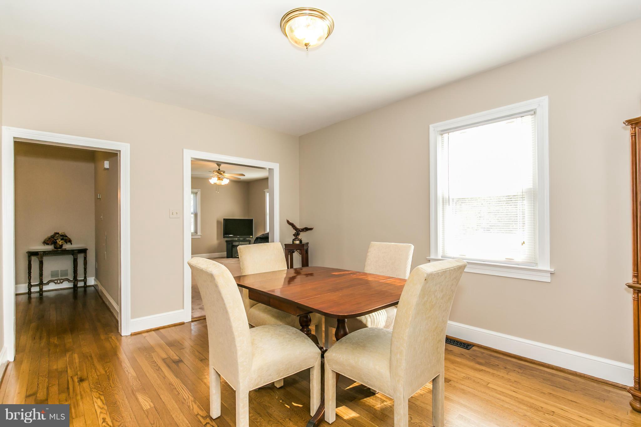 20935 Potomac View Road Sterling, VA 20165 - Photo 9 of 30 a view of a dining room with furniture and wooden floor