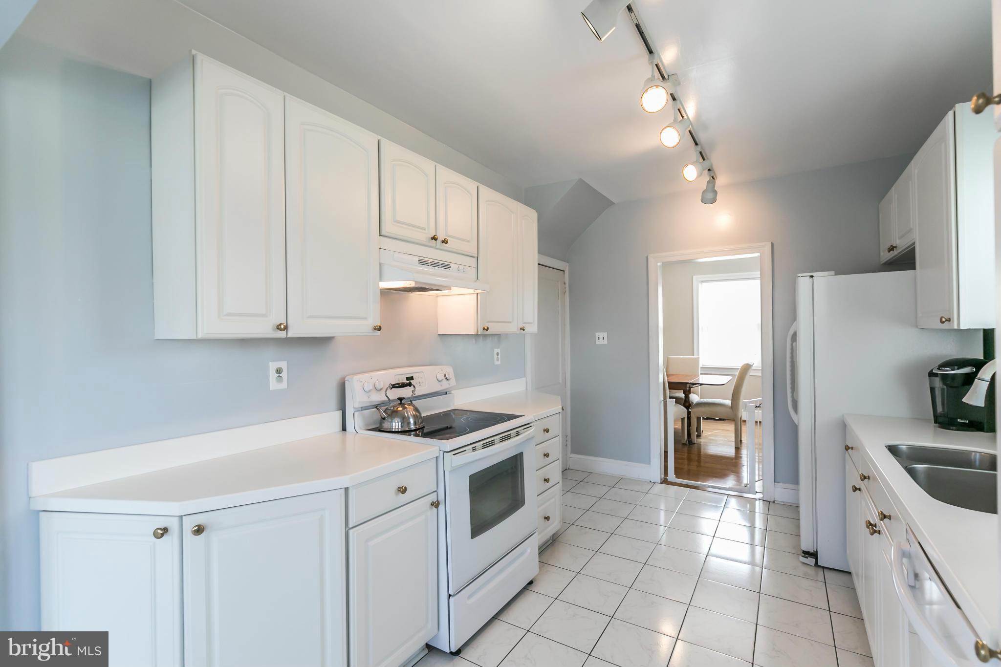 20935 Potomac View Road Sterling, VA 20165 - Photo 10 of 30 a kitchen with stainless steel appliances a stove a sink and a refrigerator