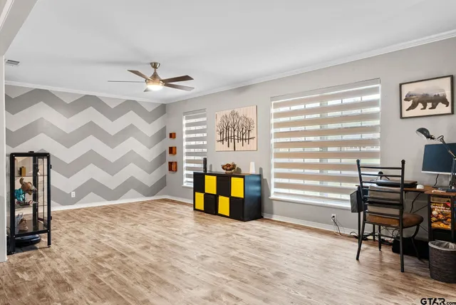 a view of a livingroom with furniture and a window