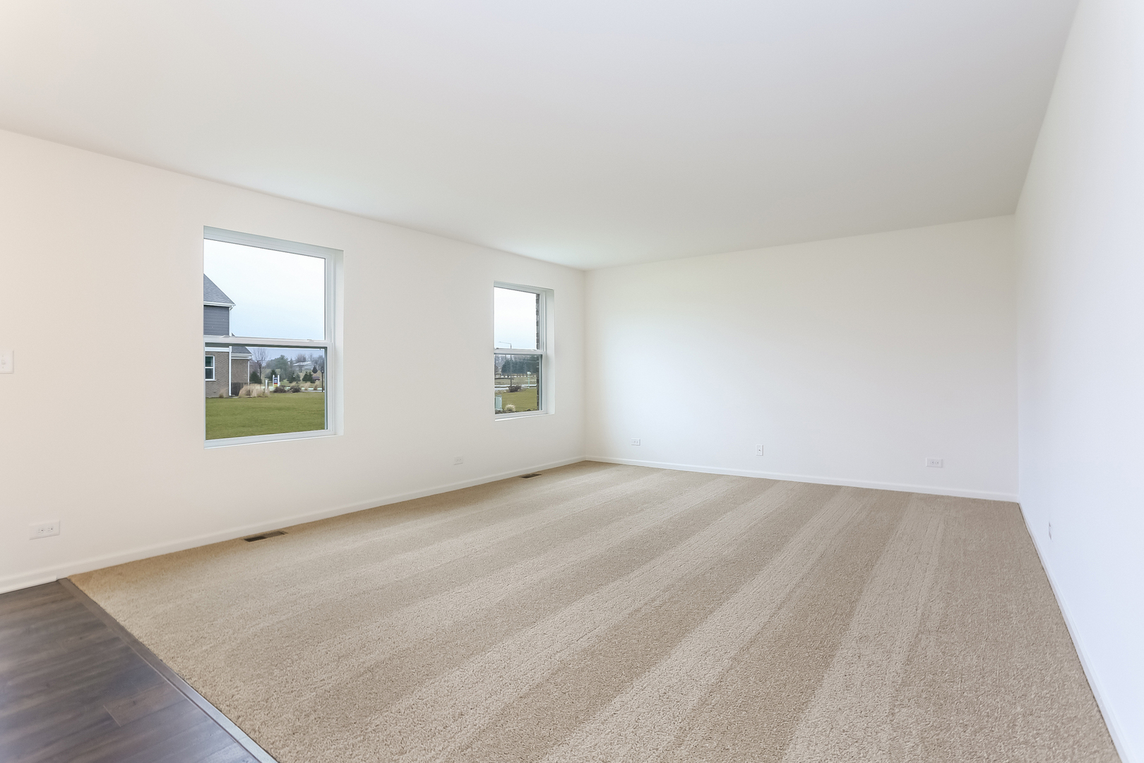2026 Rownham Hill Road New Lenox, IL 60451 - Photo 5 of 15 an empty room with windows