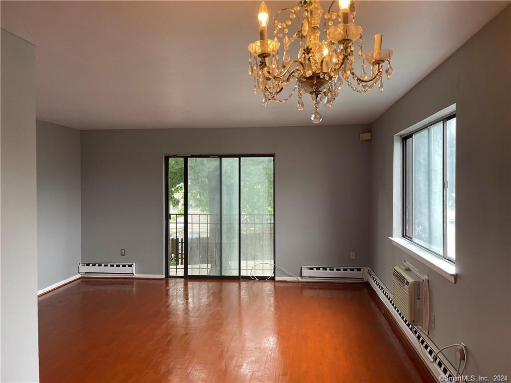 235 Cove Road, Unit 1 Stamford, CT 06902 - Photo 3 of 9 a view of an empty room with a window