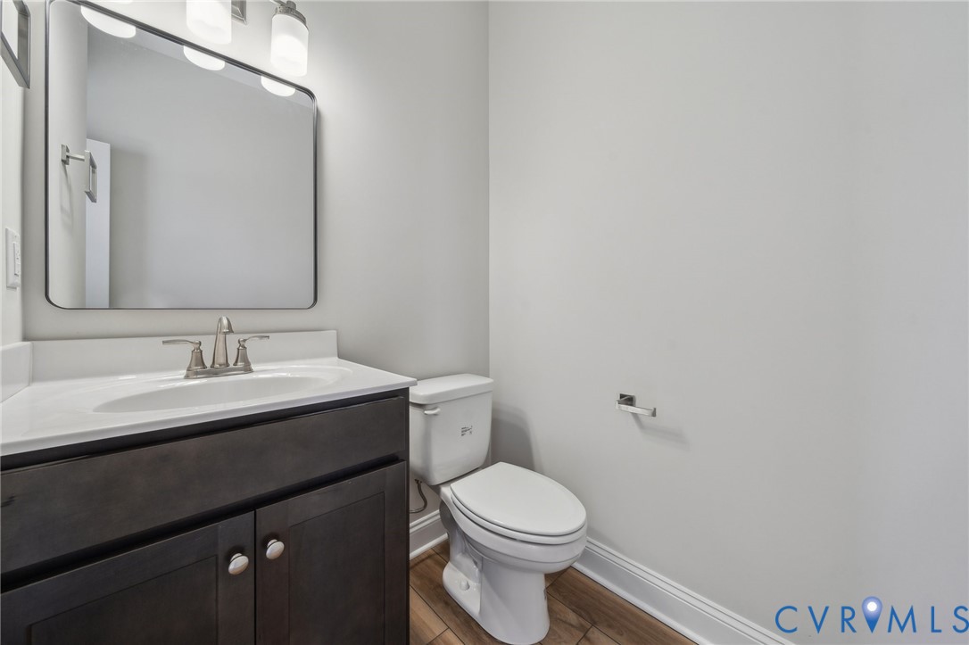 2910 Congress Road North Chesterfield, VA 23237 - Photo 12 of 20 a bathroom with a toilet a sink and mirror