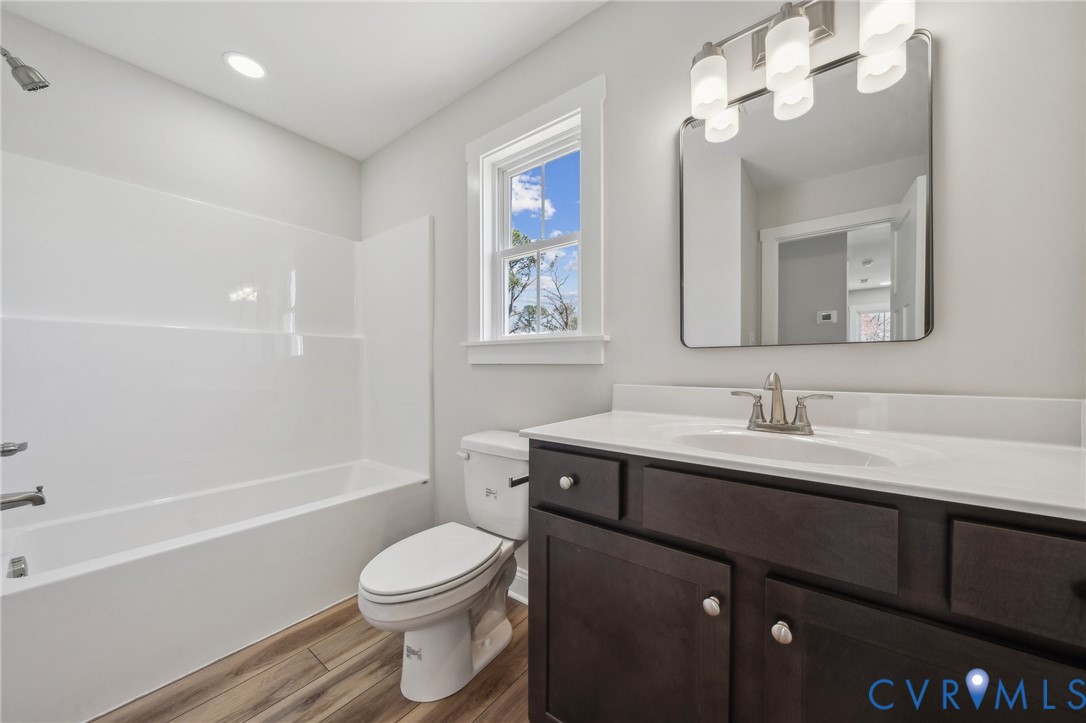 2910 Congress Road North Chesterfield, VA 23237 - Photo 18 of 20 a bathroom with a toilet a sink a tub and a mirror