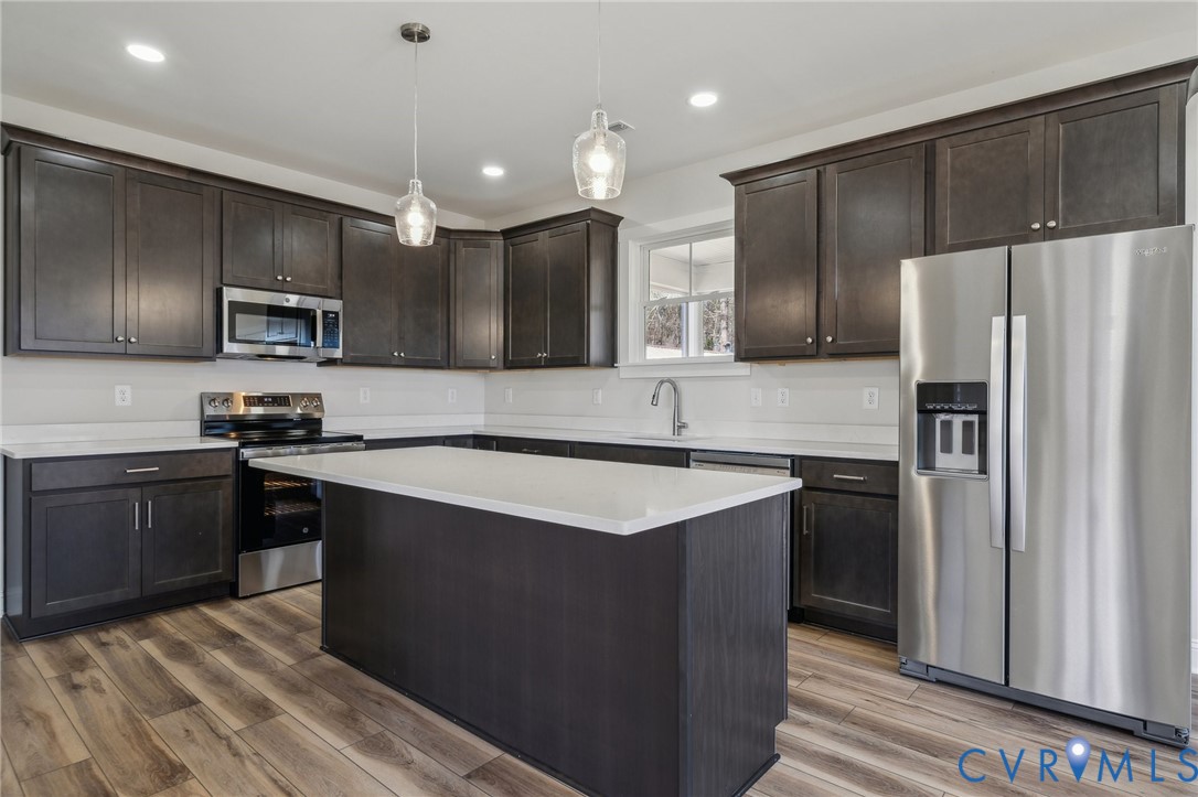 2910 Congress Road North Chesterfield, VA 23237 - Photo 6 of 20 a kitchen with stainless steel appliances granite countertop a sink stove and refrigerator