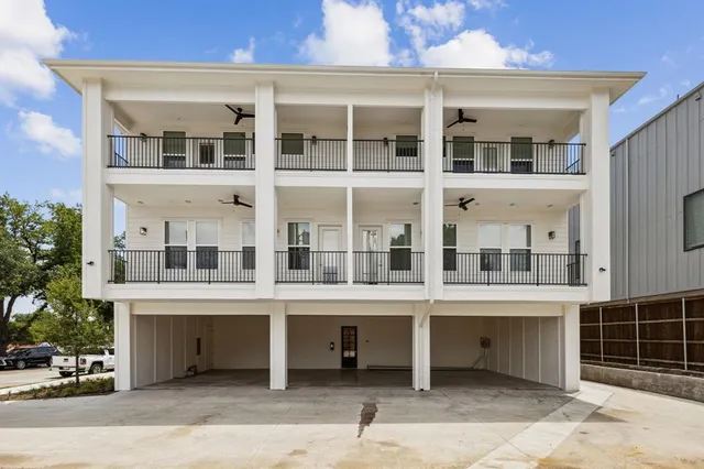 a view of a building with a yard