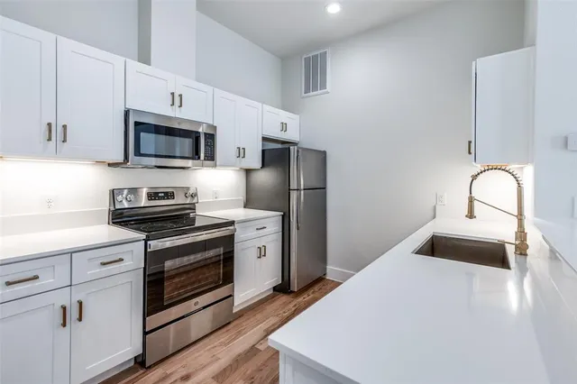 a view of kitchen with wooden floor