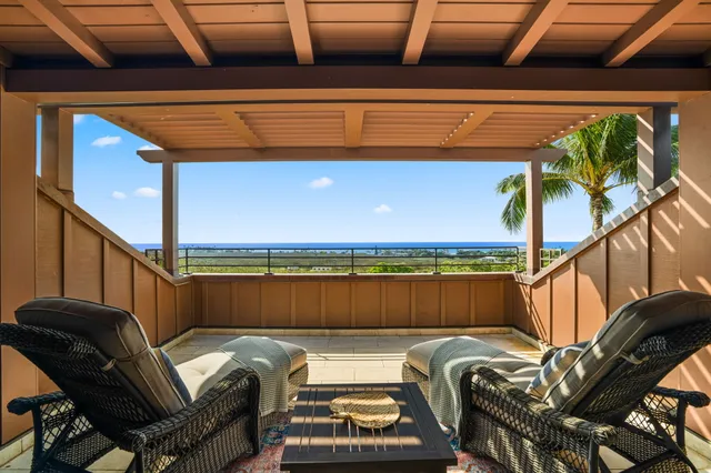 a dining room with furniture and garden view