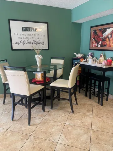 a view of a tables and chairs in a room