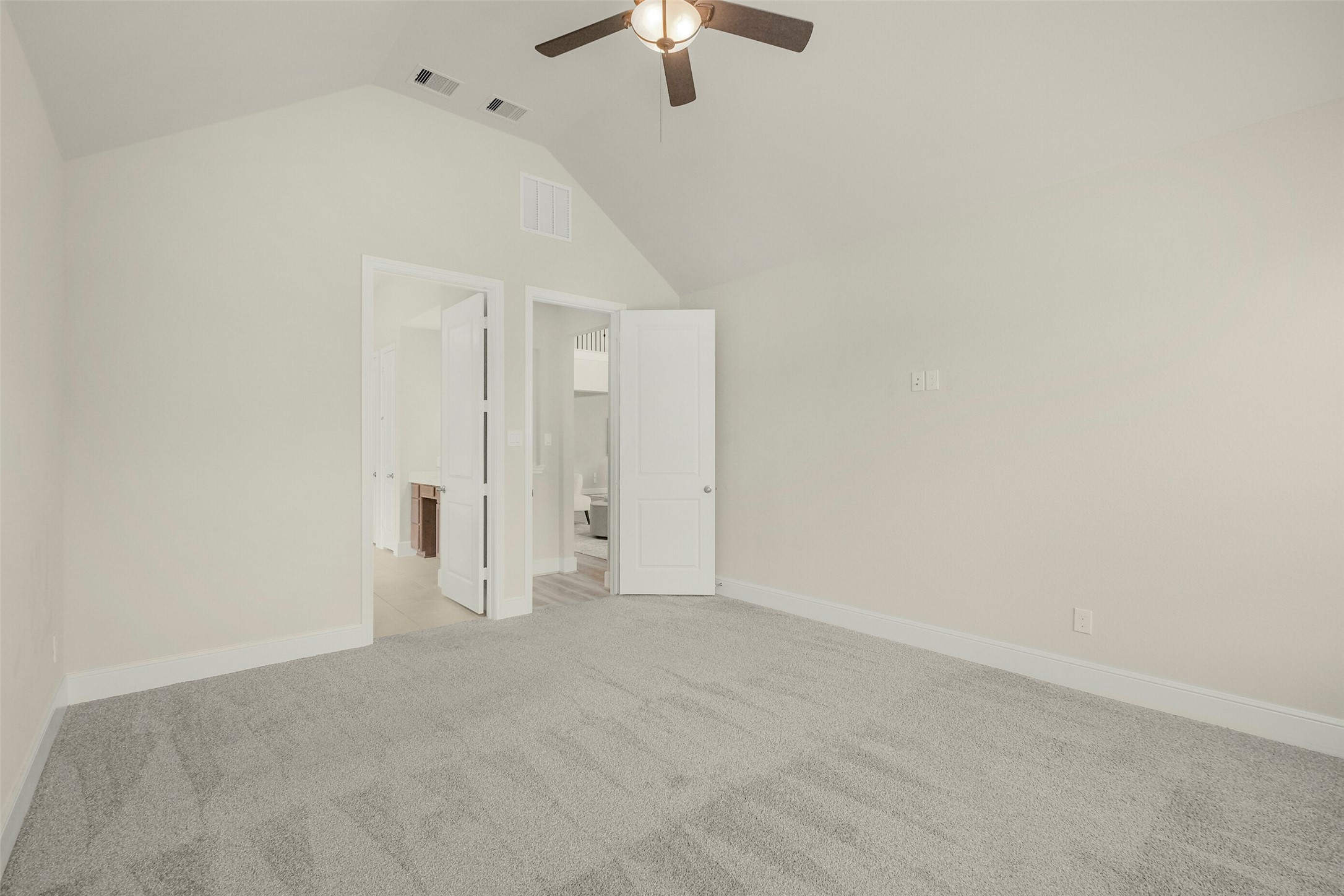 10514 Rigel Rdg Way Richmond, TX 77406 - Photo 26 of 50 Another view of the primary bedroom shows just how much space there is for a full bedroom furniture arrangement, with the private en-suite bath just steps away.