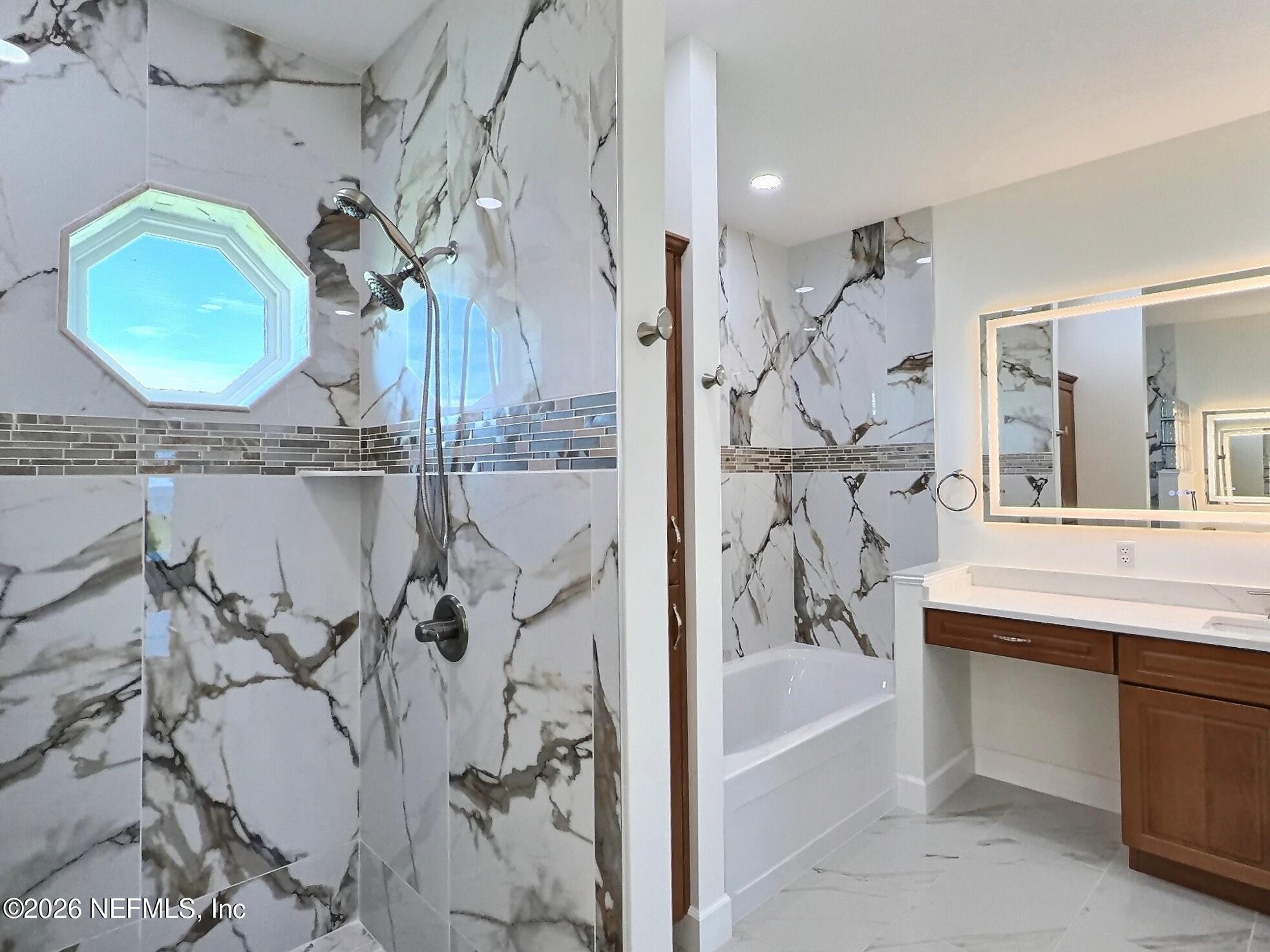 159 Mays Cove Road East Palatka, FL 32131 - Photo 23 of 62 a bathroom with a bathtub sink and mirror