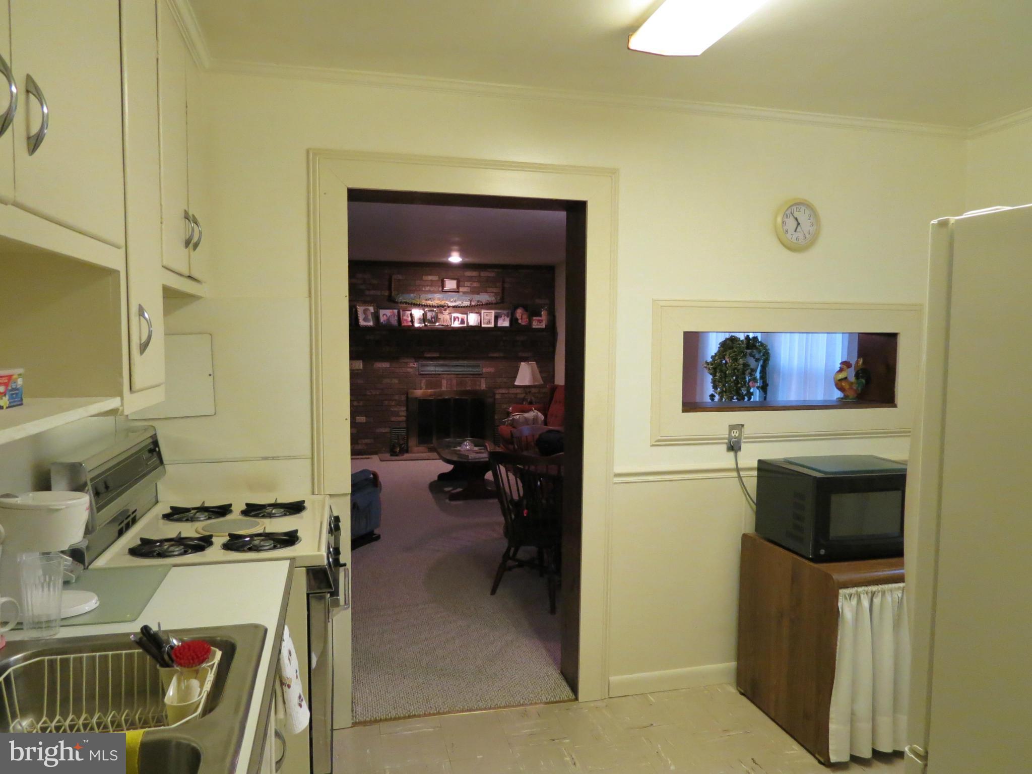 12129 Selfridge Road Silver Spring, MD 20906 - Photo 12 of 28 Kitchen is open to family room with pass thru
