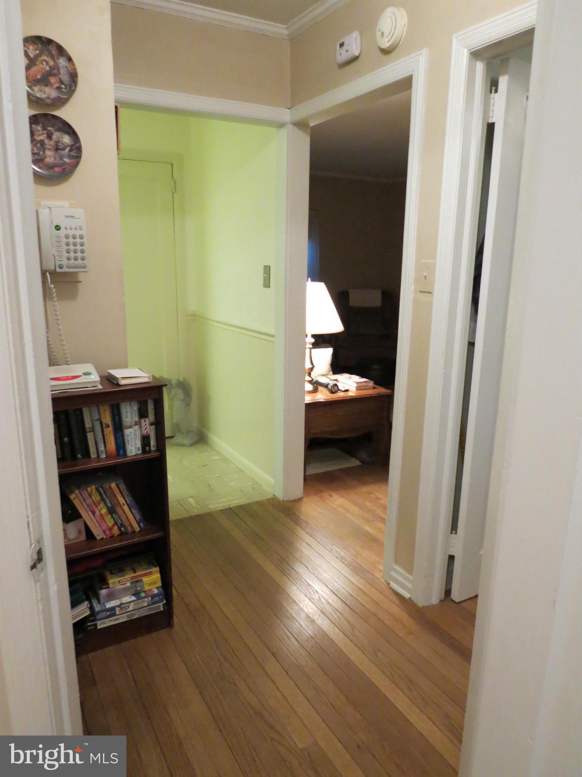 12129 Selfridge Road Silver Spring, MD 20906 - Photo 21 of 28 Hallway between bedrooms, hardwood floors