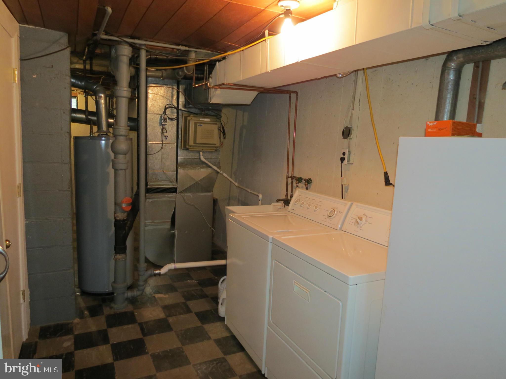 12129 Selfridge Road Silver Spring, MD 20906 - Photo 28 of 28 Laundry area & newer Carrier gas furnace