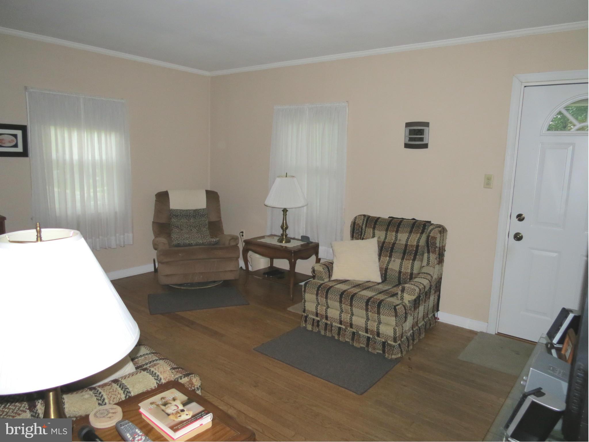 12129 Selfridge Road Silver Spring, MD 20906 - Photo 9 of 28 Living Room with entry door to front