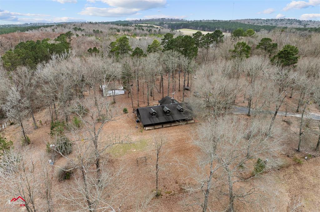 6951 Mira Myrtis Road Ida, LA 71044 - Photo 12 of 32 Aerial view with a wooded view