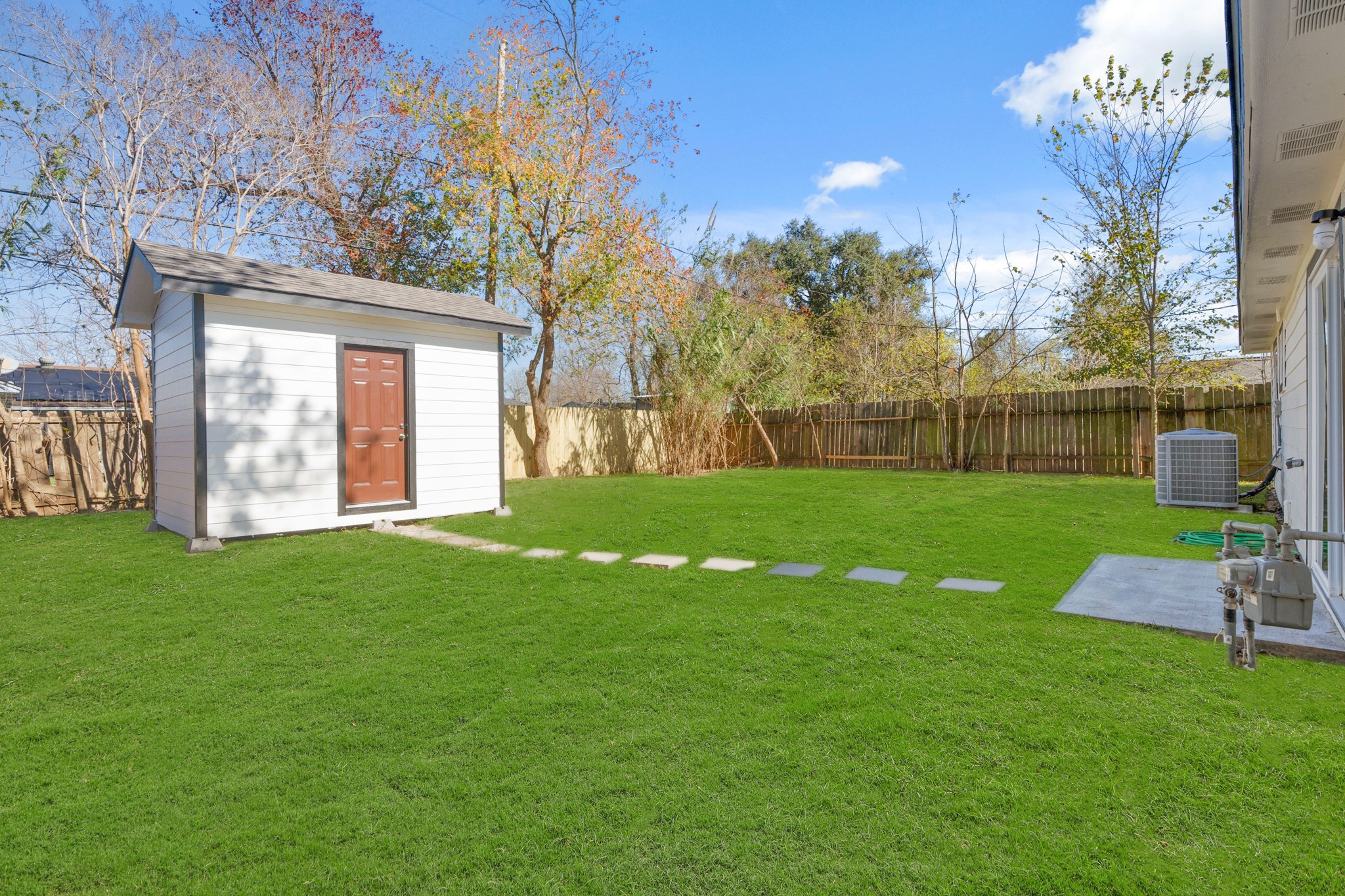 5123 Ridgeway Drive Houston, TX 77033 - Photo 18 of 21 The backyard features a storage shed too.