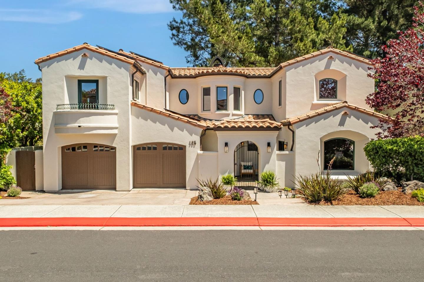 a front view of a house with a yard