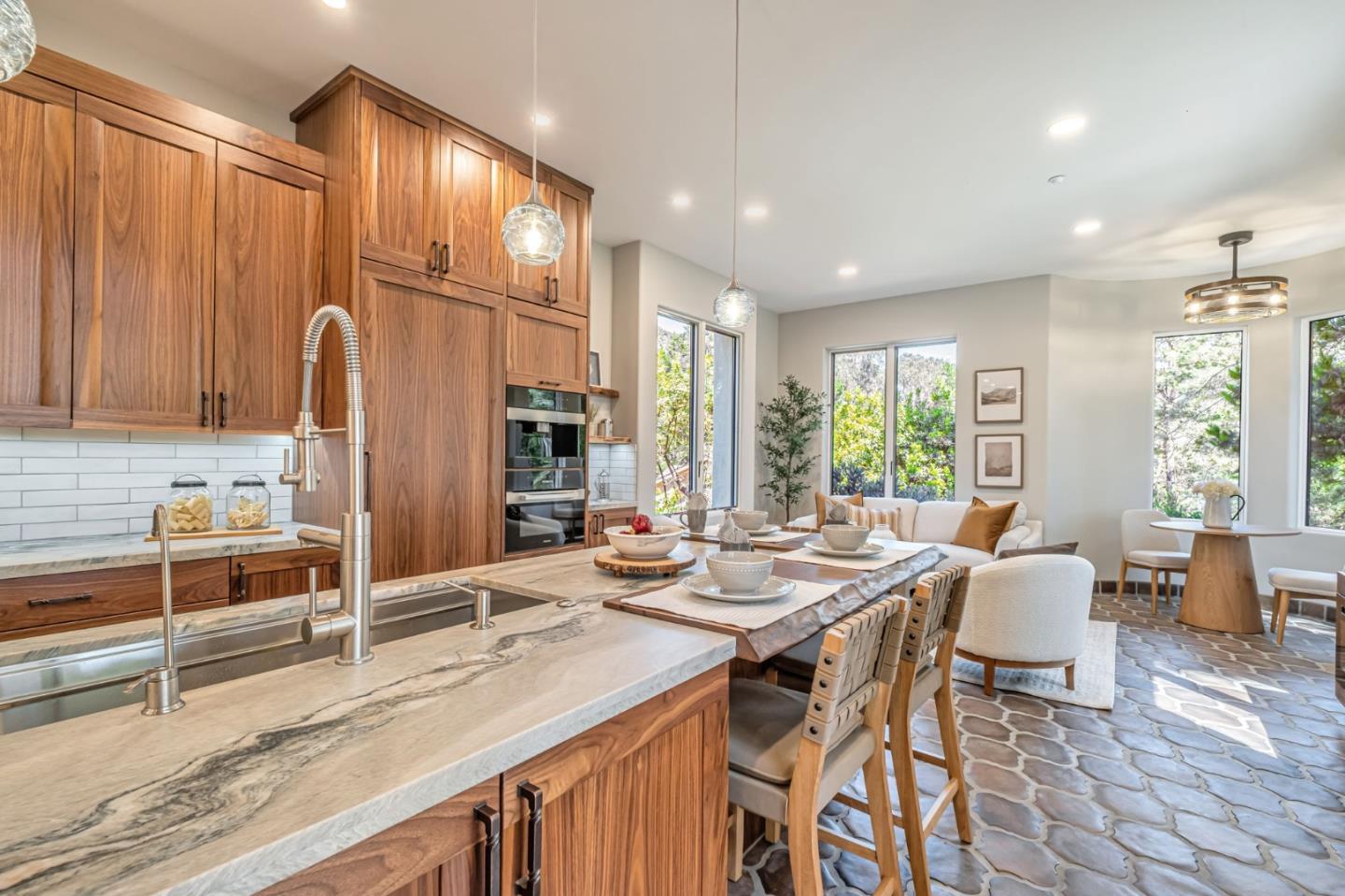 125 Zanzibar Drive Aptos, CA 95003 - Photo 11 of 52 a large kitchen with kitchen island granite countertop a dining table chairs and large window