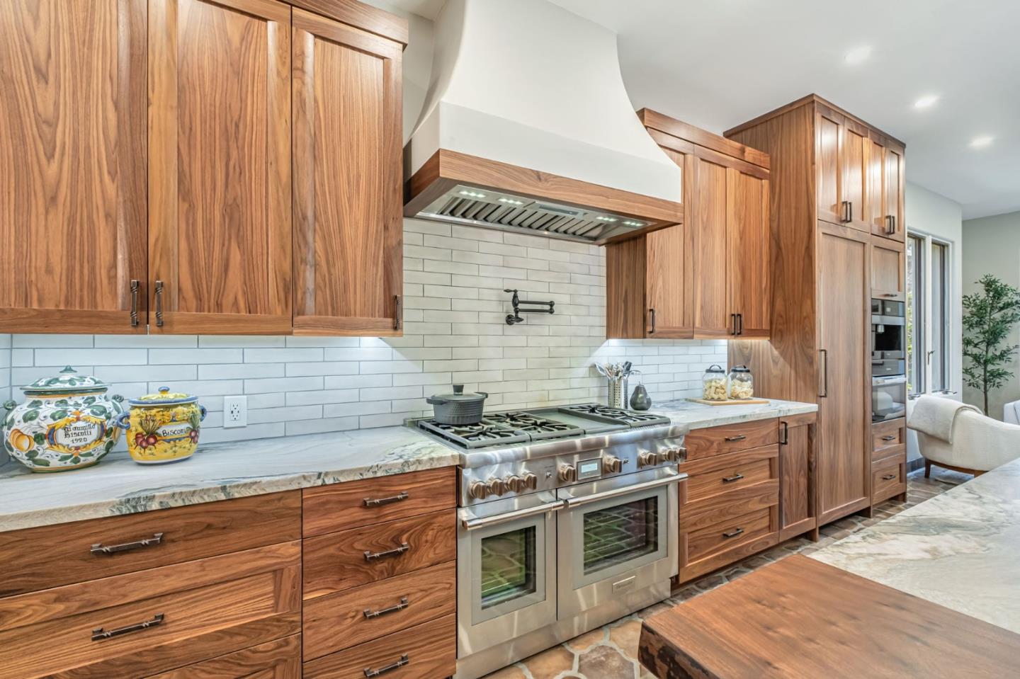 125 Zanzibar Drive Aptos, CA 95003 - Photo 15 of 52 a kitchen with stainless steel appliances granite countertop a stove a sink dishwasher and cabinets with wooden floor