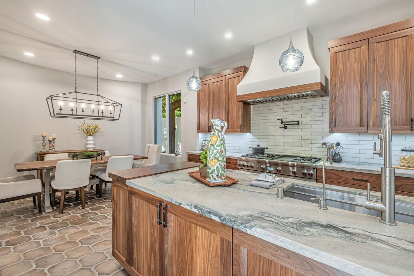 125 Zanzibar Drive Aptos, CA 95003 - Photo 16 of 52 a kitchen with sink cabinets and dining table