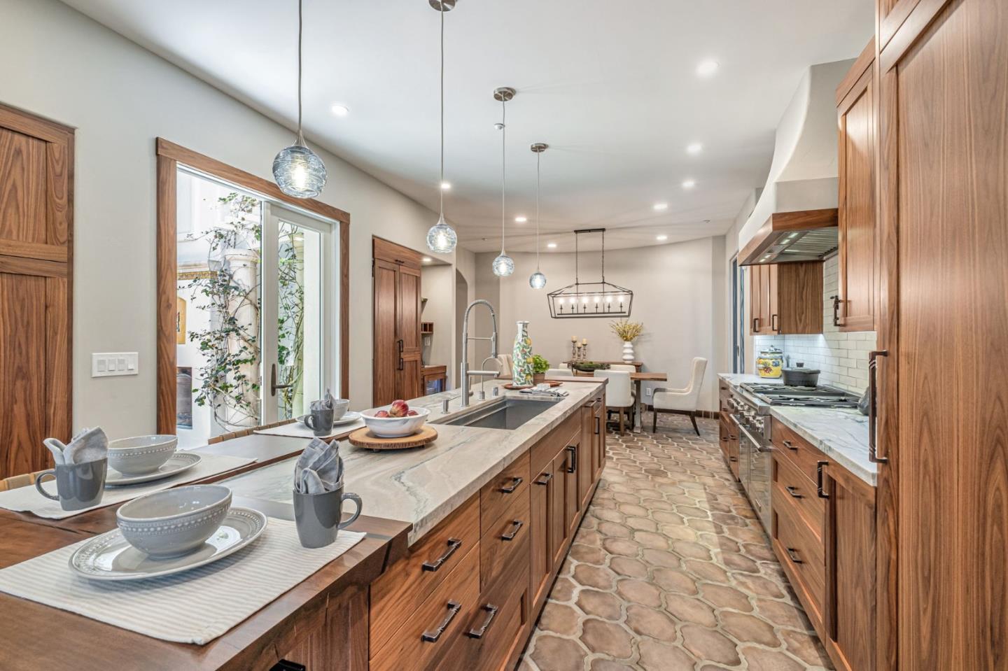 125 Zanzibar Drive Aptos, CA 95003 - Photo 19 of 52 a large kitchen with kitchen island a large window a sink and stainless steel appliances