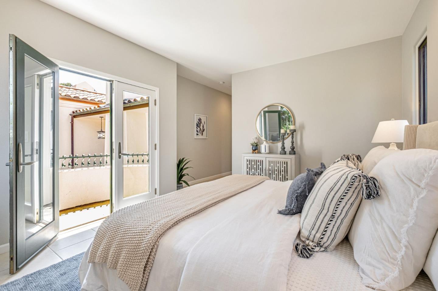 125 Zanzibar Drive Aptos, CA 95003 - Photo 30 of 52 a bedroom with a large bed and a chandelier