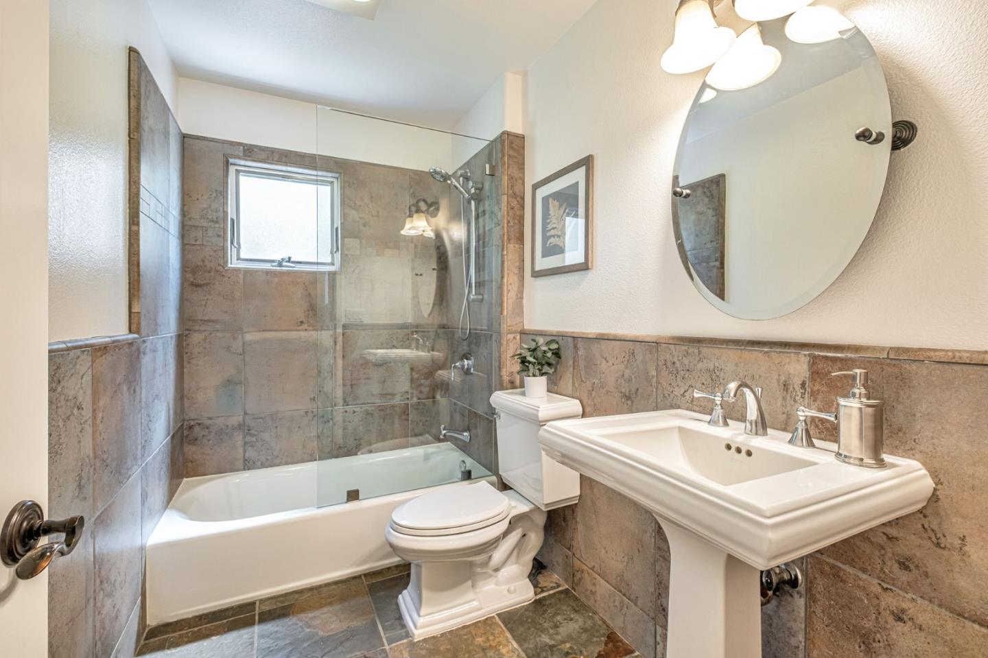 125 Zanzibar Drive Aptos, CA 95003 - Photo 38 of 52 a bathroom with a sink a toilet and a mirror