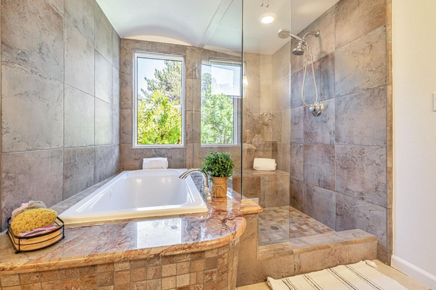 125 Zanzibar Drive Aptos, CA 95003 - Photo 39 of 52 a bathroom with a tub a sink and window