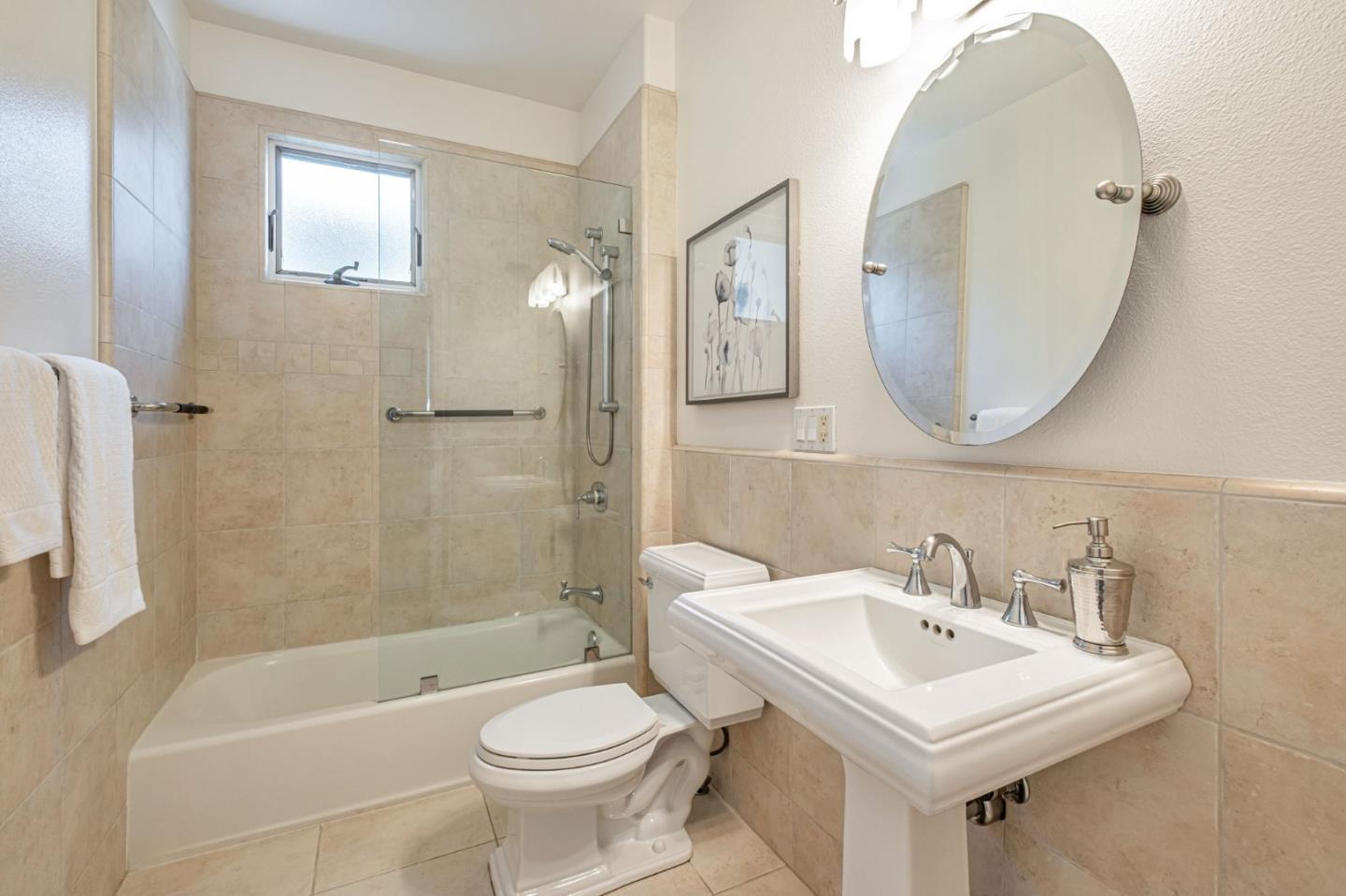 125 Zanzibar Drive Aptos, CA 95003 - Photo 41 of 52 a bathroom with a sink a toilet and a mirror