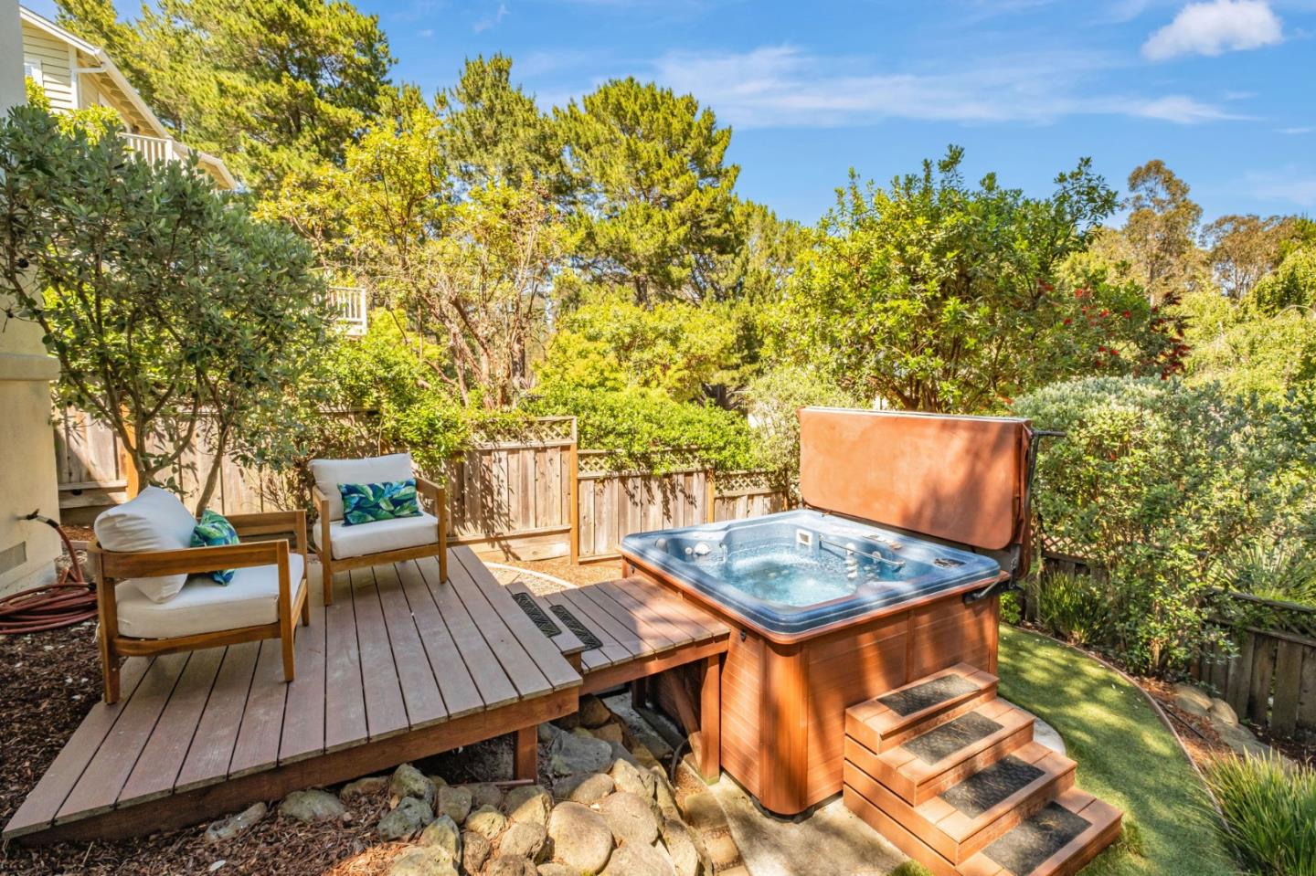 125 Zanzibar Drive Aptos, CA 95003 - Photo 49 of 52 a backyard of a house with table and chairs