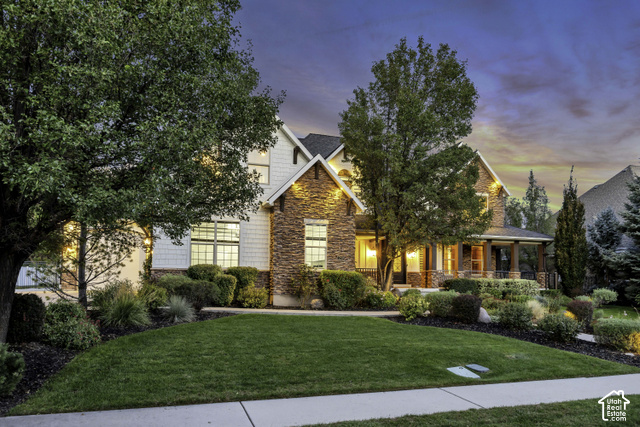 259 Twin River Loop Alpine, UT 84004 - Photo 60 of 61 Sunset Photo showing lush landscape, stone and shingle exterior with gabled roof lines.