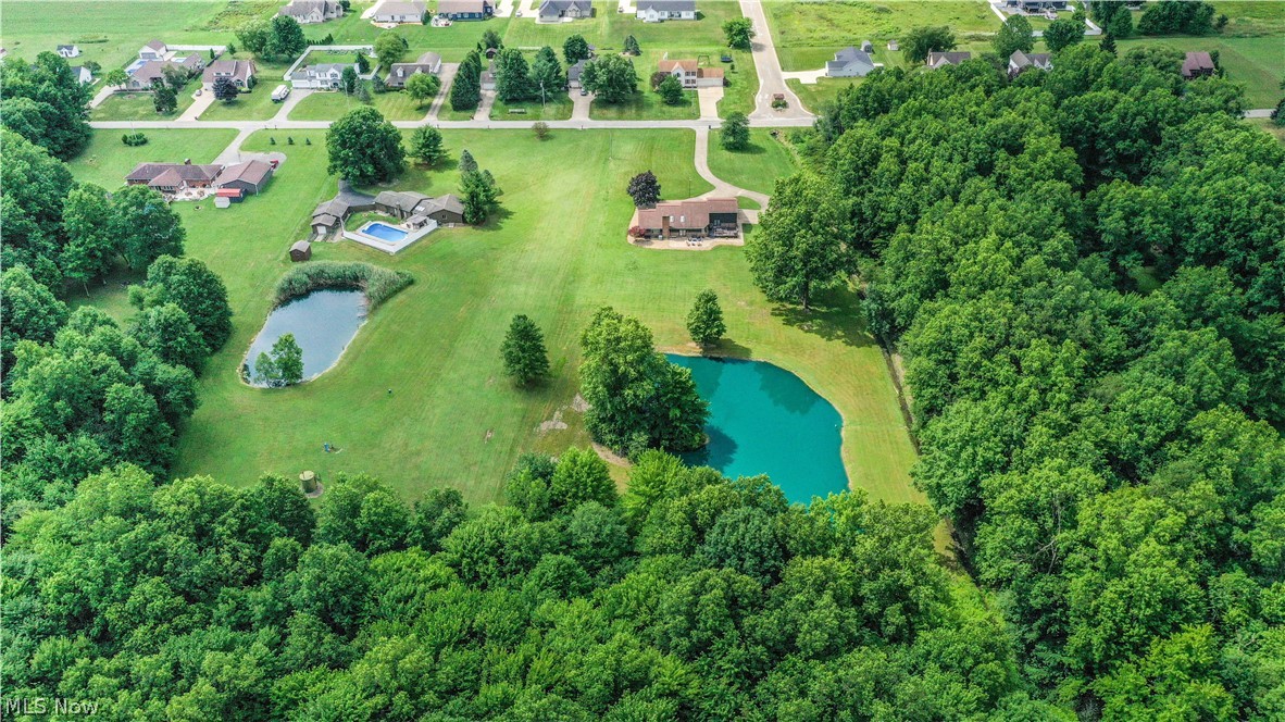 405 Airport Road Northwest Warren, OH 44481 - Photo 48 of 50 Expansive property featuring a pond, and mature tree lines.