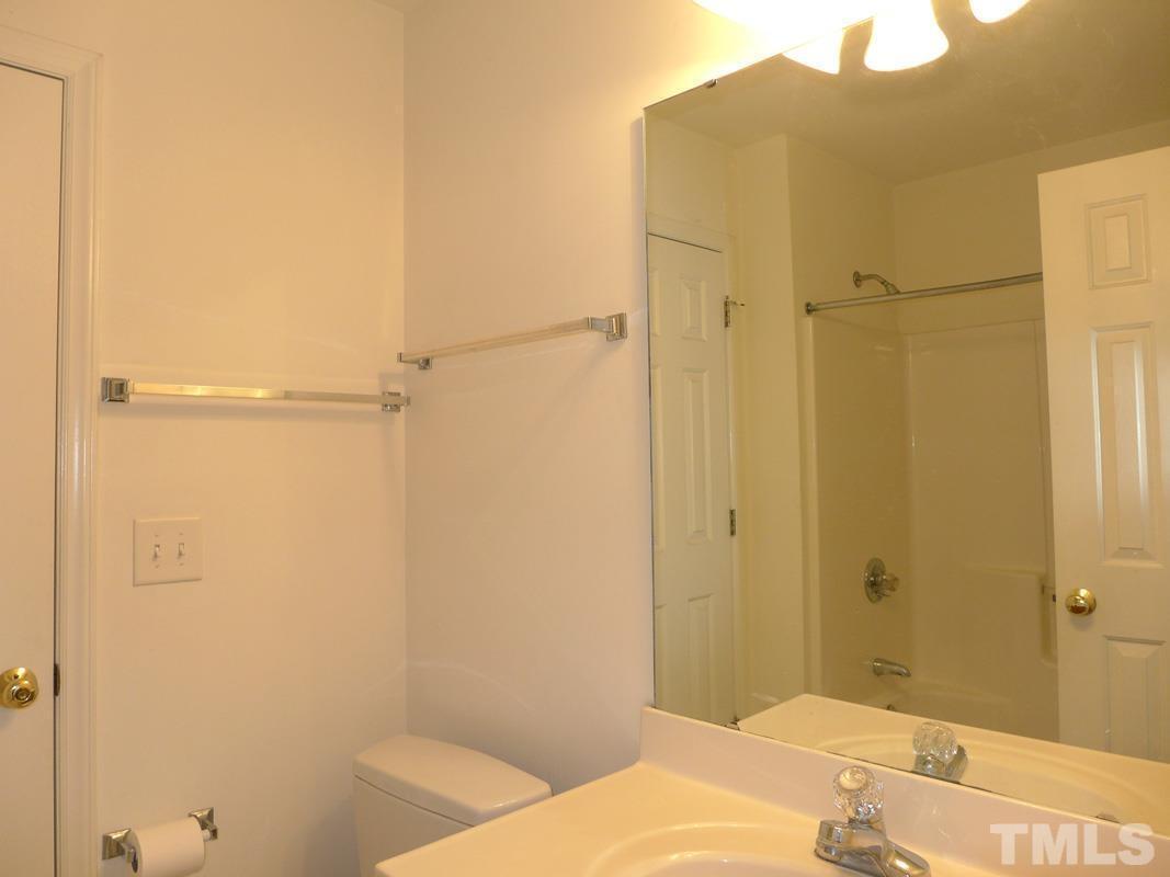 304 Davie Road Carrboro, NC 27510 - Photo 13 of 18 a bathroom with a bathtub and shower