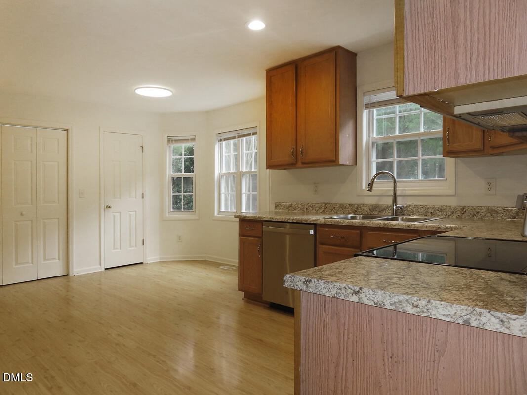 304 Davie Road Carrboro, NC 27510 - Photo 9 of 18 a kitchen with granite countertop a sink and a stove