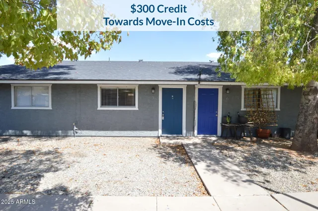 a house with trees in the background