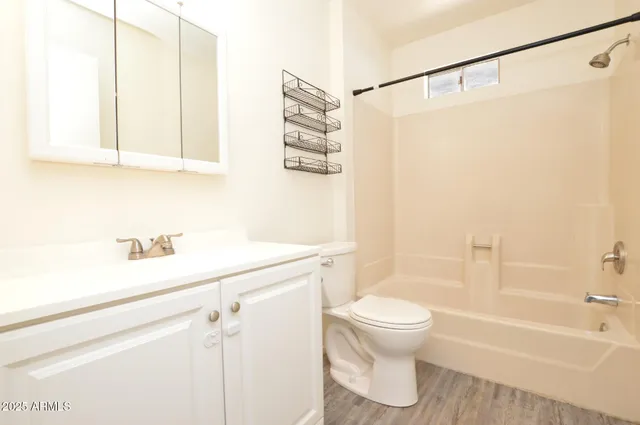 a bathroom with a sink a toilet and a bathtub