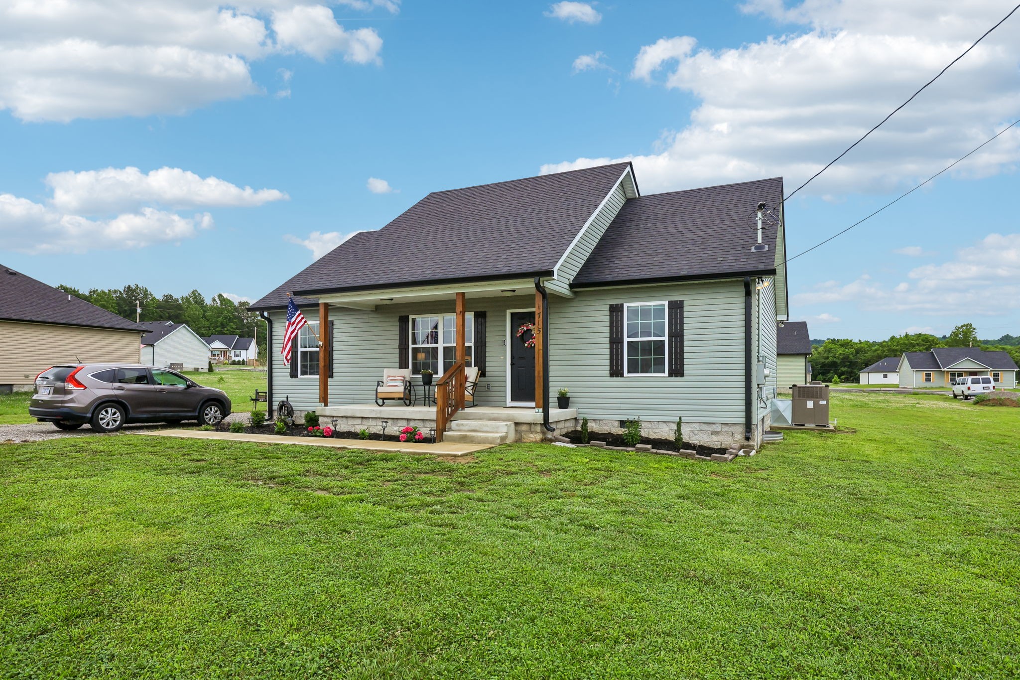 1715 Old Belfast Road Lewisburg, TN 37091 - Photo 3 of 42 a front view of a house with a garden and yard