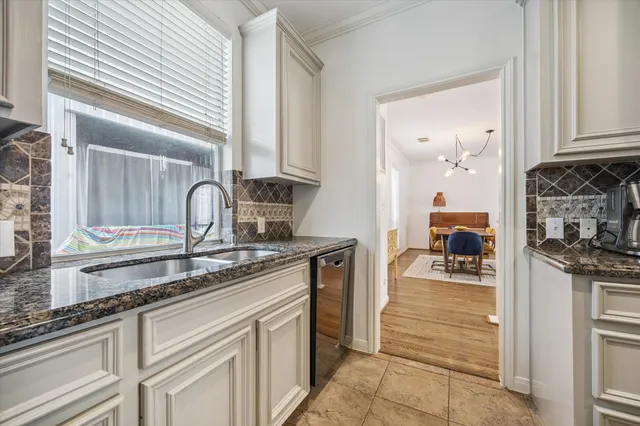 a kitchen with stainless steel appliances granite countertop a sink stove and cabinets