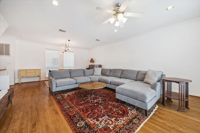 a living room with furniture and a rug