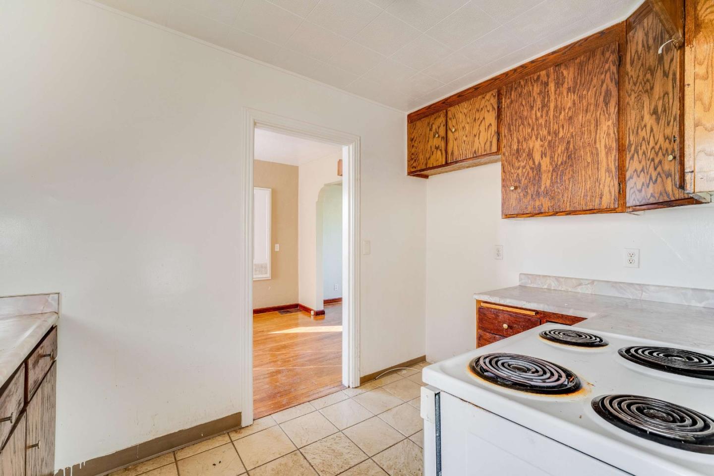1 Spruce Street Vallejo, CA 94591 - Photo 14 of 35 a kitchen with a stove and a refrigerator
