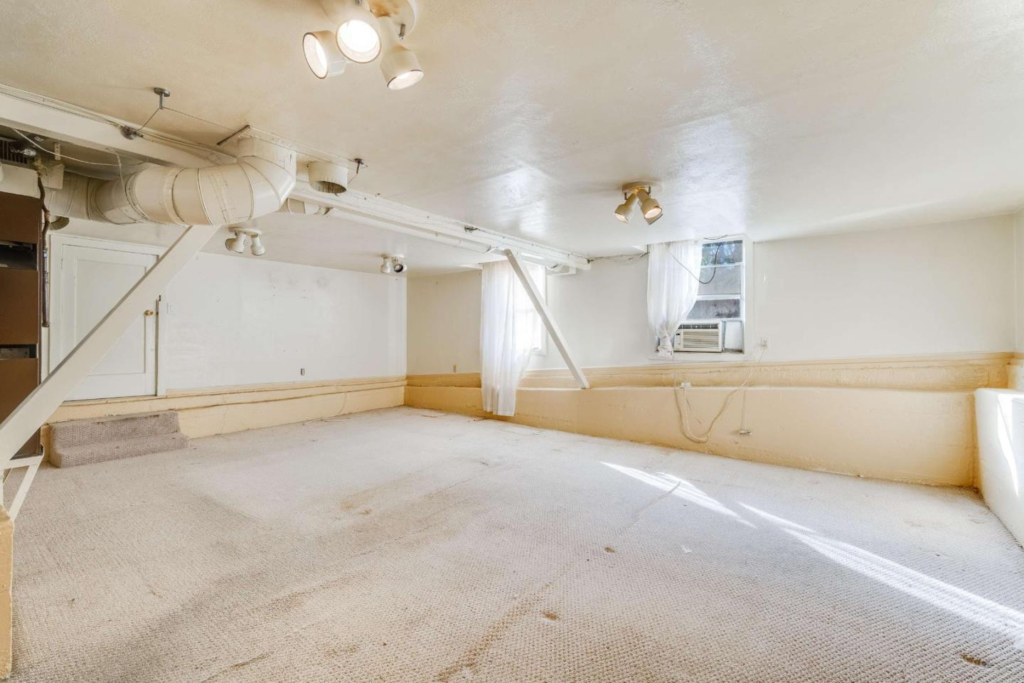 1 Spruce Street Vallejo, CA 94591 - Photo 22 of 35 an empty room with a ceiling fan and window