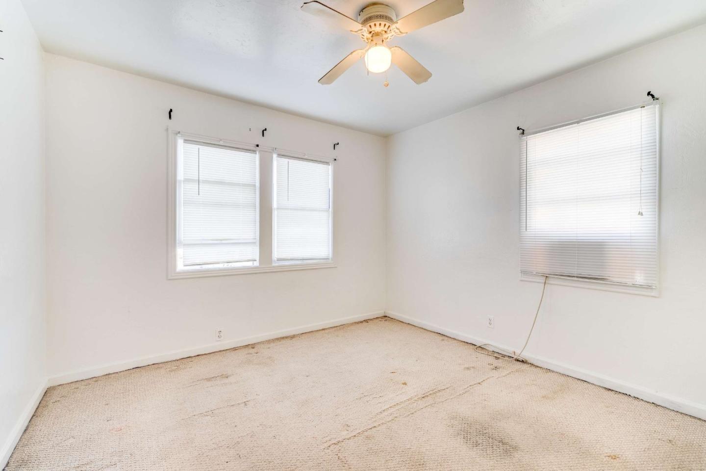 1 Spruce Street Vallejo, CA 94591 - Photo 24 of 35 an empty room with windows and fan