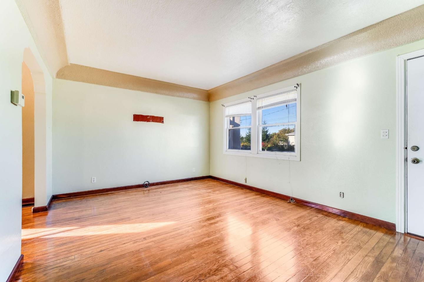 1 Spruce Street Vallejo, CA 94591 - Photo 5 of 35 a view of an empty room with wooden floor