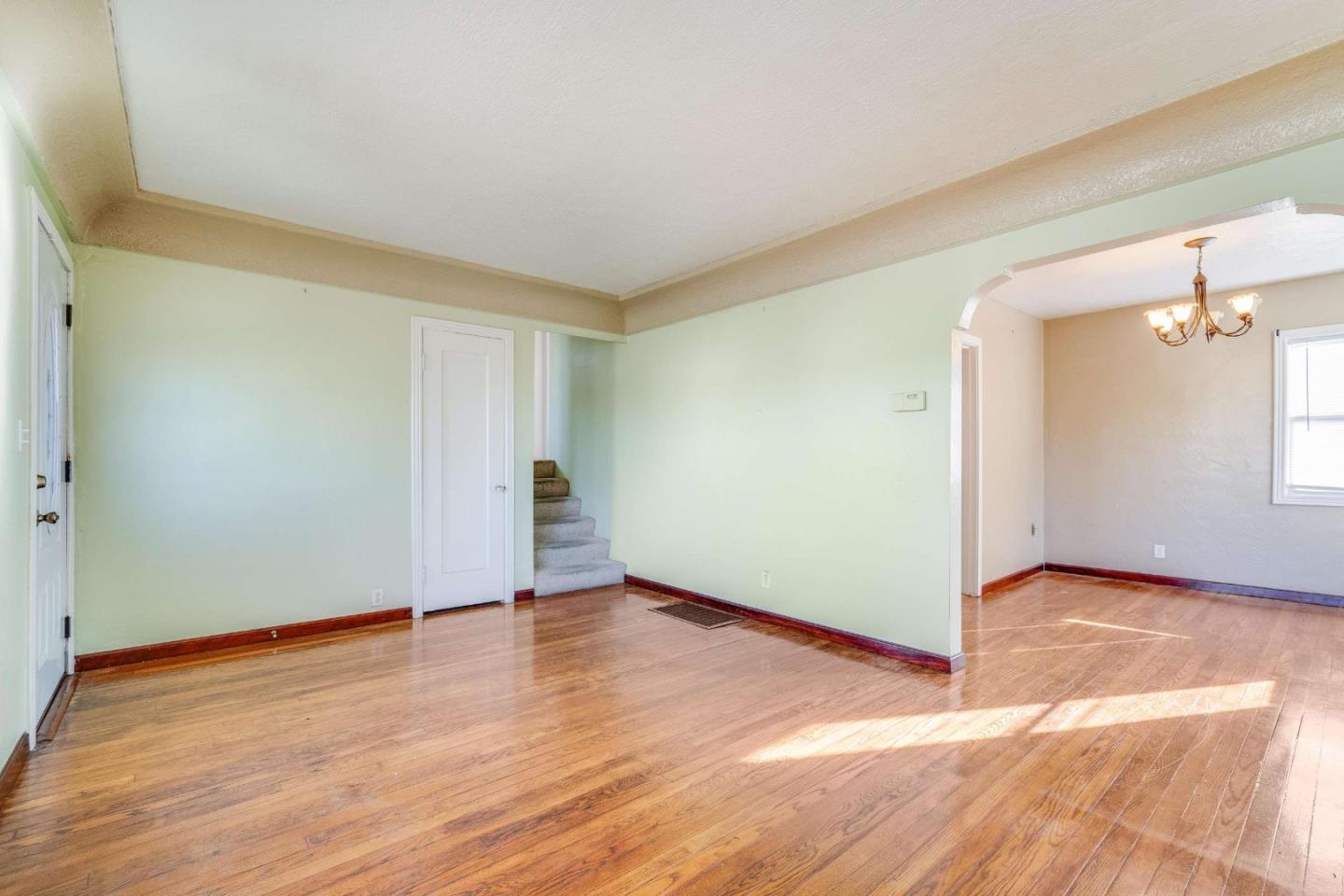 1 Spruce Street Vallejo, CA 94591 - Photo 7 of 35 an empty room with wooden floor and windows