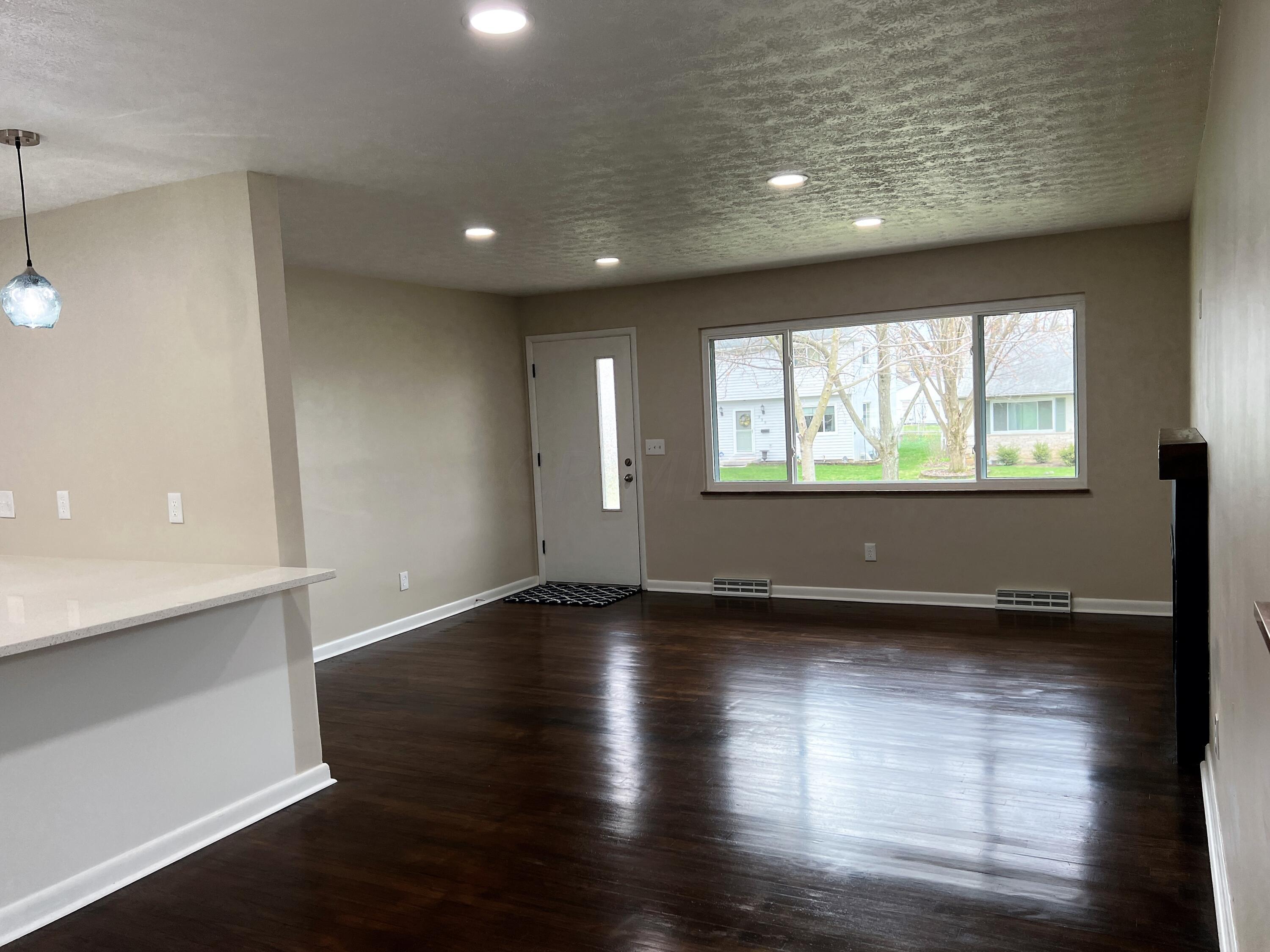 996 Wetmore Road Columbus, OH 43224 - Photo 4 of 22 996 Wetmore - Living Room and Dining Spa
