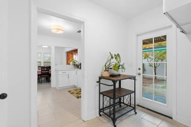 a workspace room with furniture and wooden floor