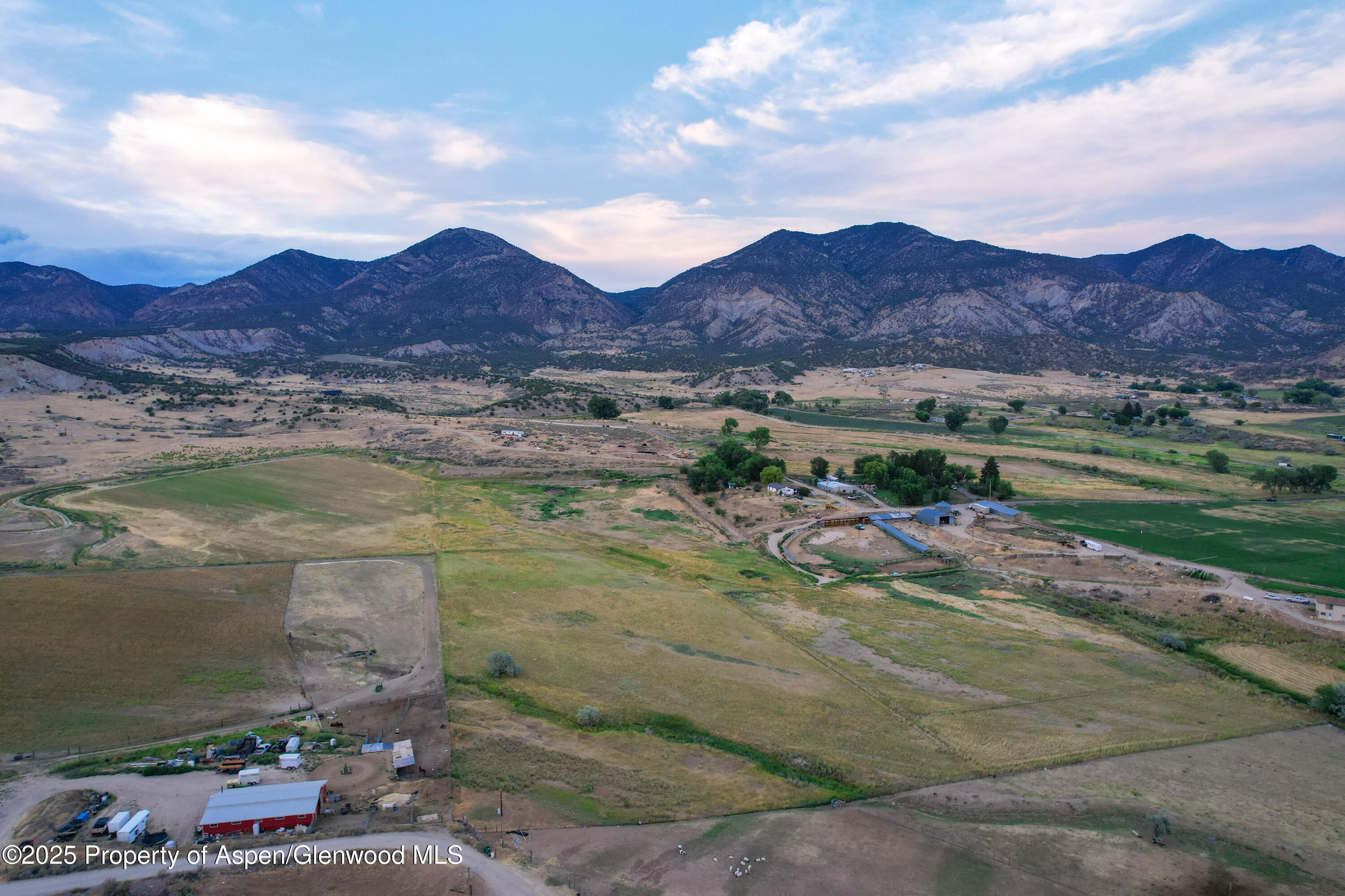 Lot 14 259a Rifle, CO 81650 - Photo 6 of 6 a view of a lush green hillside and houses