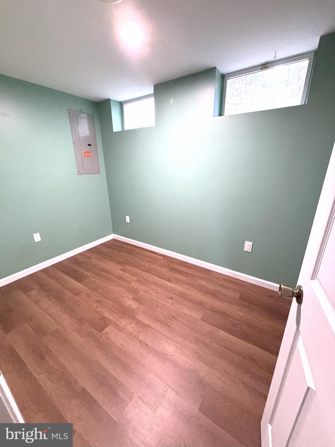 8220 Red Wing Court Frederick, MD 21701 - Photo 14 of 17 a view of a big room with wooden floor