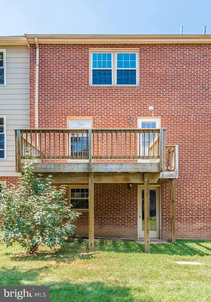 8220 Red Wing Court Frederick, MD 21701 - Photo 15 of 17 a front view of a house with a garden